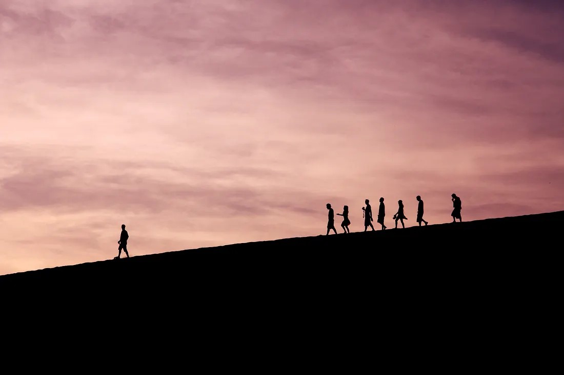 A leader out front, team following — setting direction not dictating steps