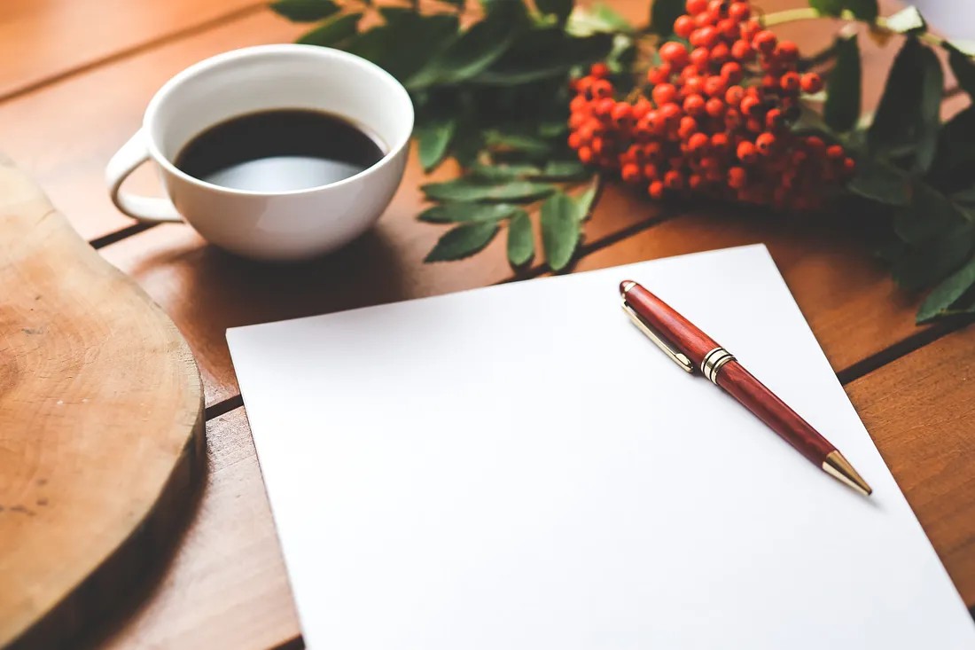 A blank page and pen — ready to write your leadership manifesto